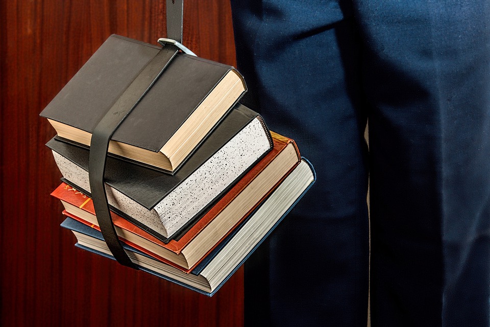 books tied up by a black belt