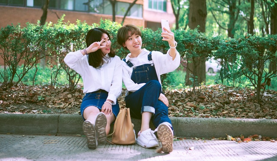 2 Asian girls taking a selfie