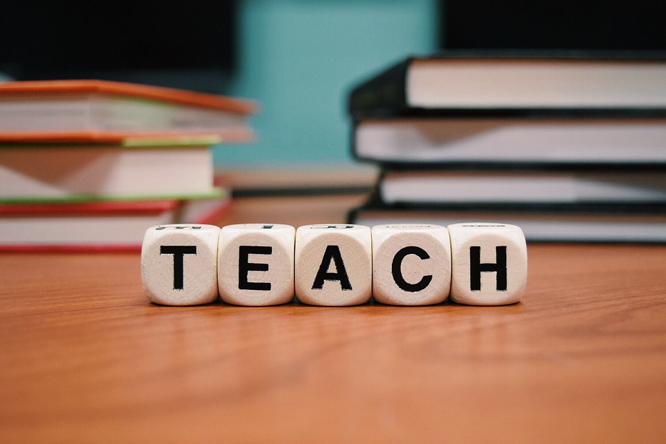 teach phrase on scrabble dice